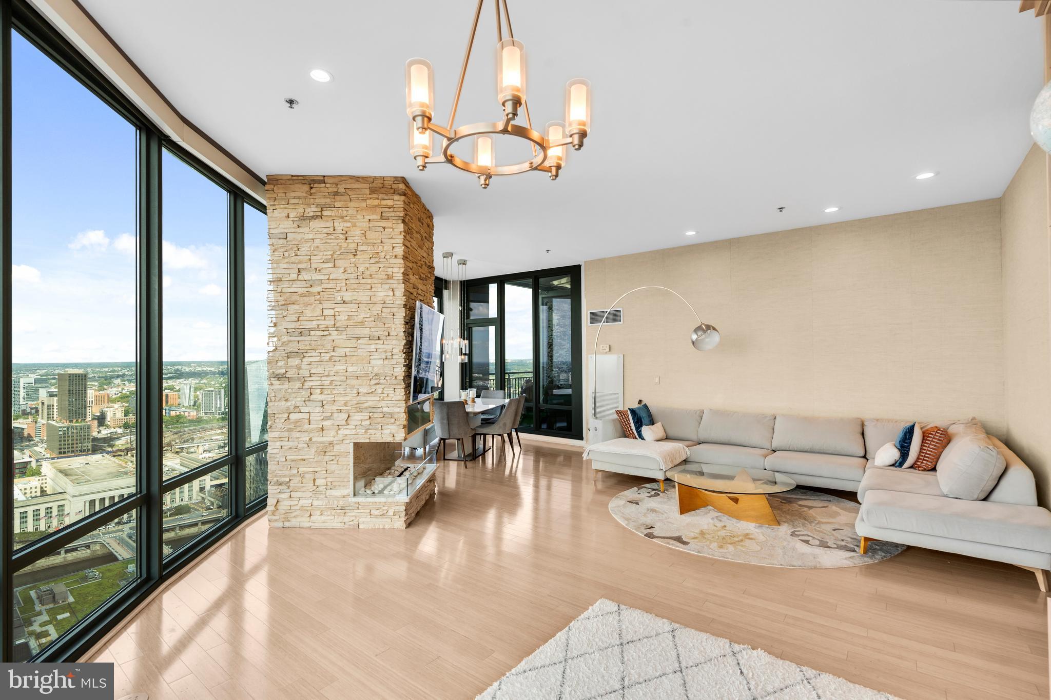 2101 Market Street, Unit PH02 Philadelphia, PA 19103 - Photo 16 of 56 a living room with furniture and a large window