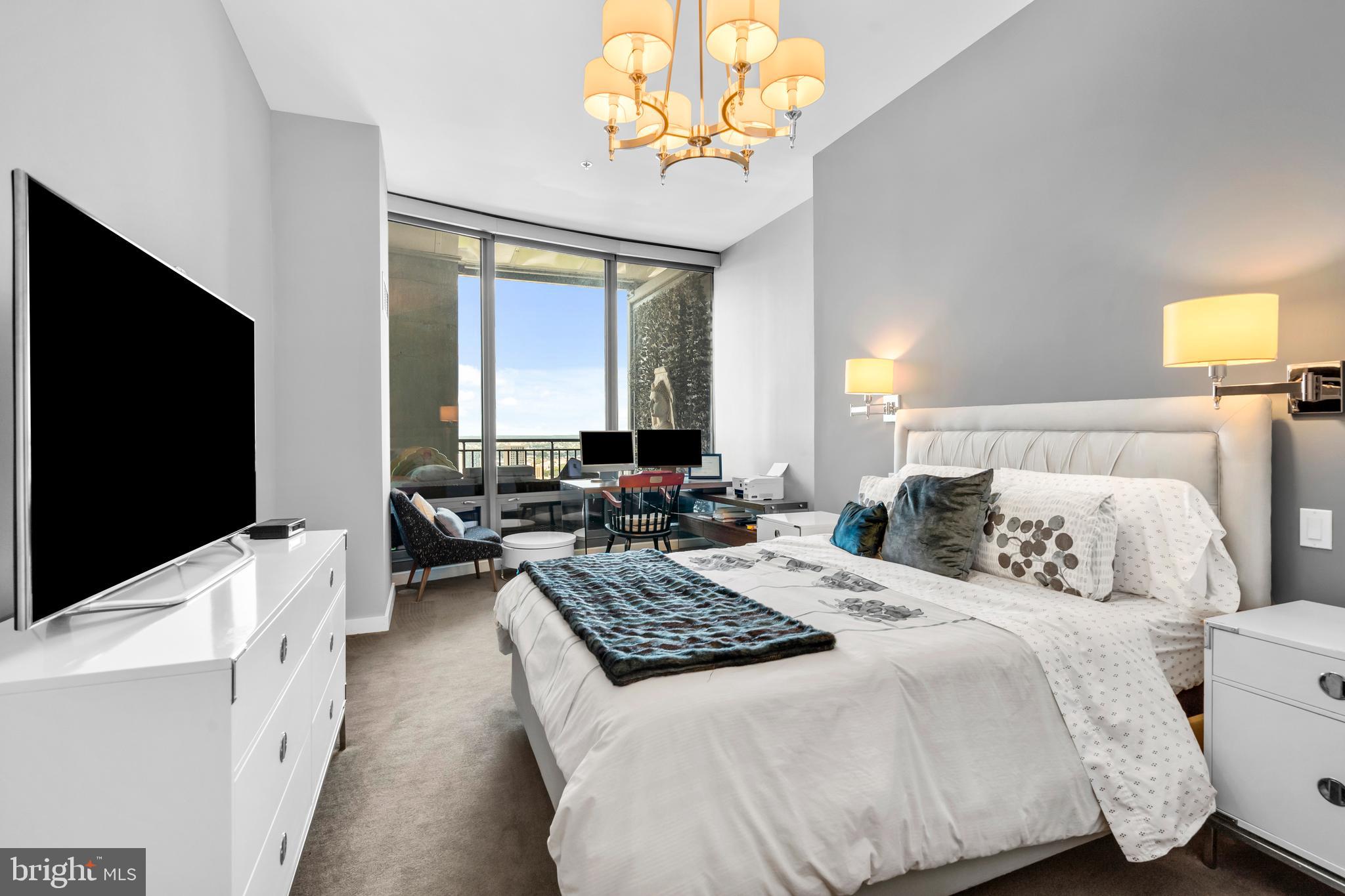 2101 Market Street, Unit PH02 Philadelphia, PA 19103 - Photo 21 of 56 a bedroom with a bed and a flat screen tv