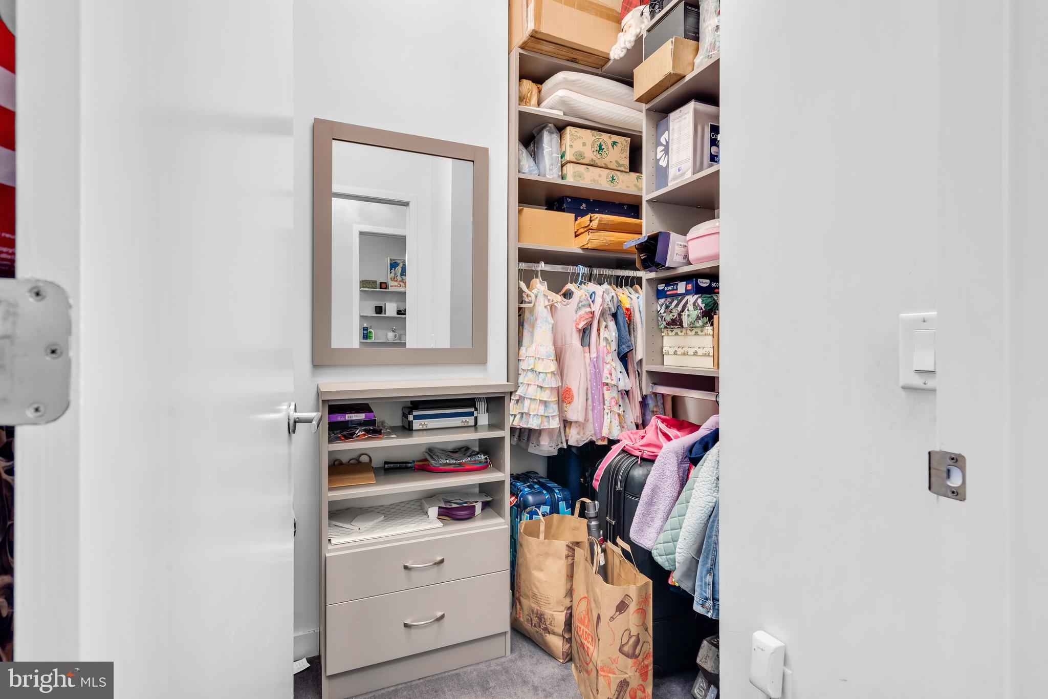 2101 Market Street, Unit PH02 Philadelphia, PA 19103 - Photo 26 of 56 a view of walk in closet with clothes and shoes