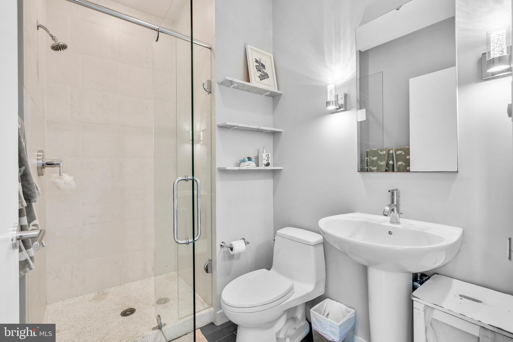 2101 Market Street, Unit PH02 Philadelphia, PA 19103 - Photo 28 of 56 a bathroom with a sink toilet and shower