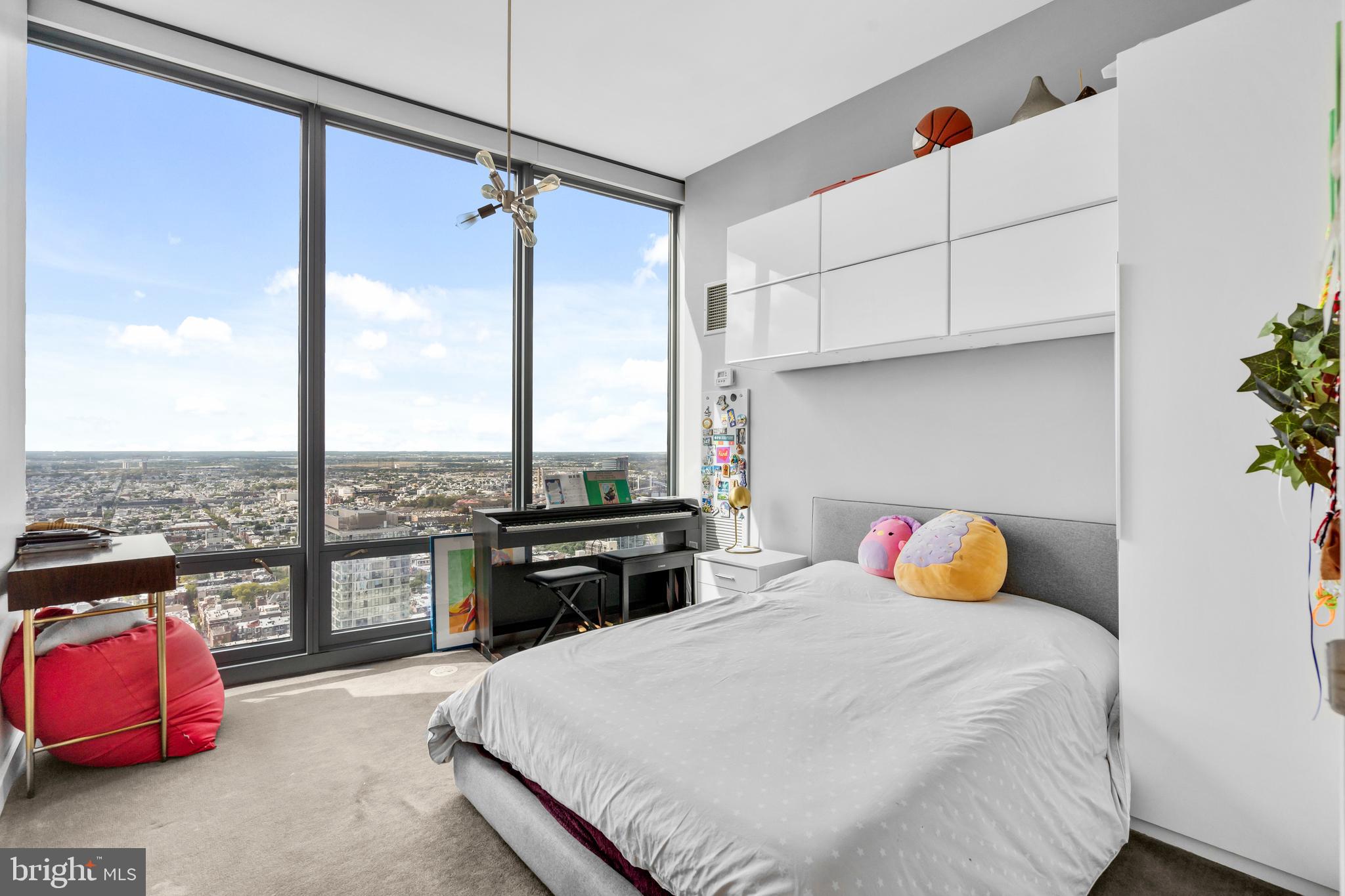 2101 Market Street, Unit PH02 Philadelphia, PA 19103 - Photo 29 of 56 a bedroom with a bed and window