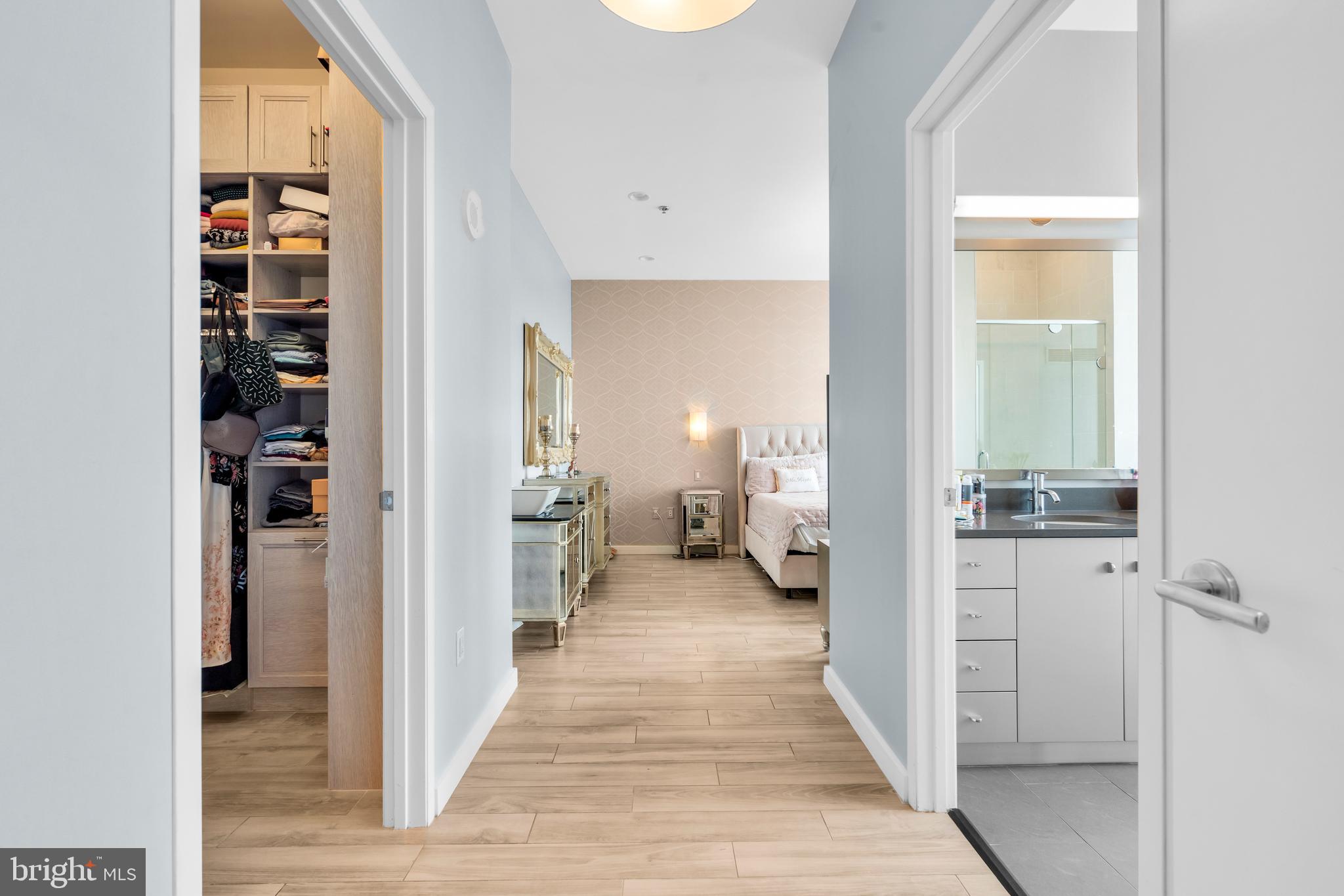2101 Market Street, Unit PH02 Philadelphia, PA 19103 - Photo 31 of 56 a view of a hallway with a livingroom and a livingroom with furniture