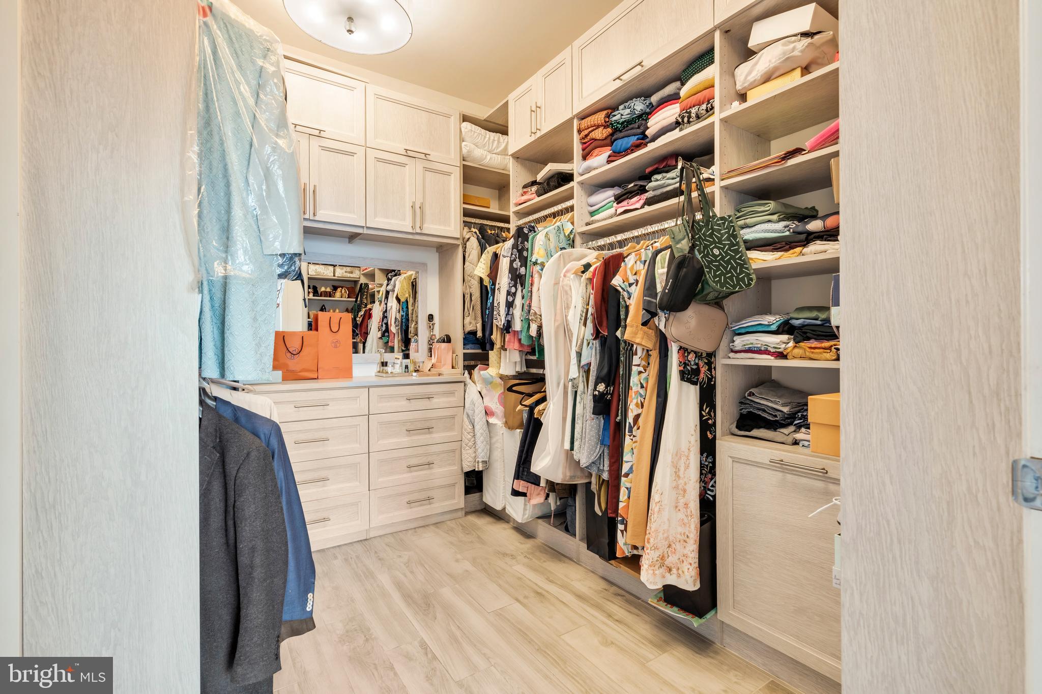 2101 Market Street, Unit PH02 Philadelphia, PA 19103 - Photo 32 of 56 a view of walk in closet with clothes and shoes