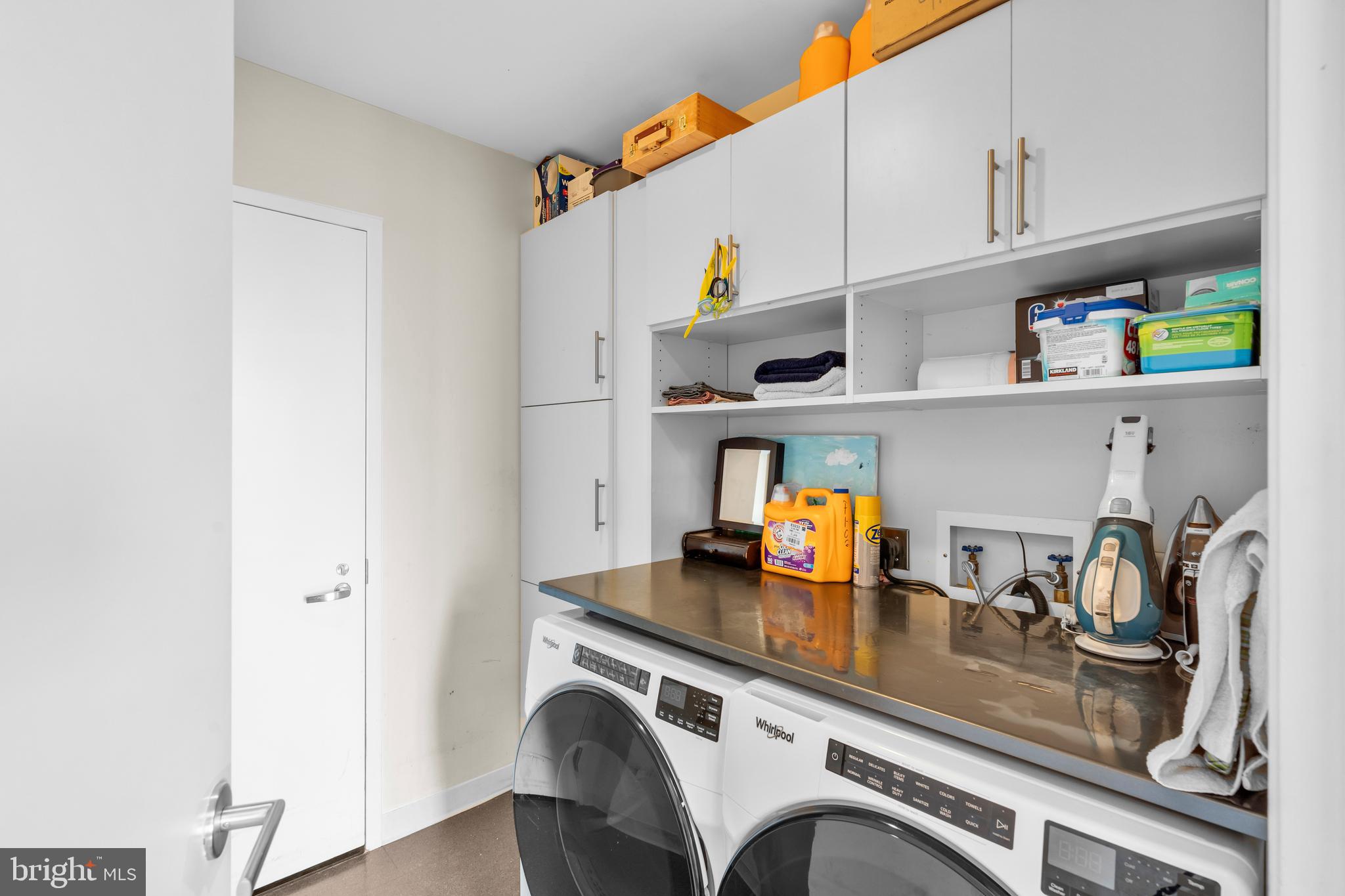2101 Market Street, Unit PH02 Philadelphia, PA 19103 - Photo 45 of 56 a view of kitchen with stainless steel appliances granite countertop a sink dishwasher and cabinets with wooden floor