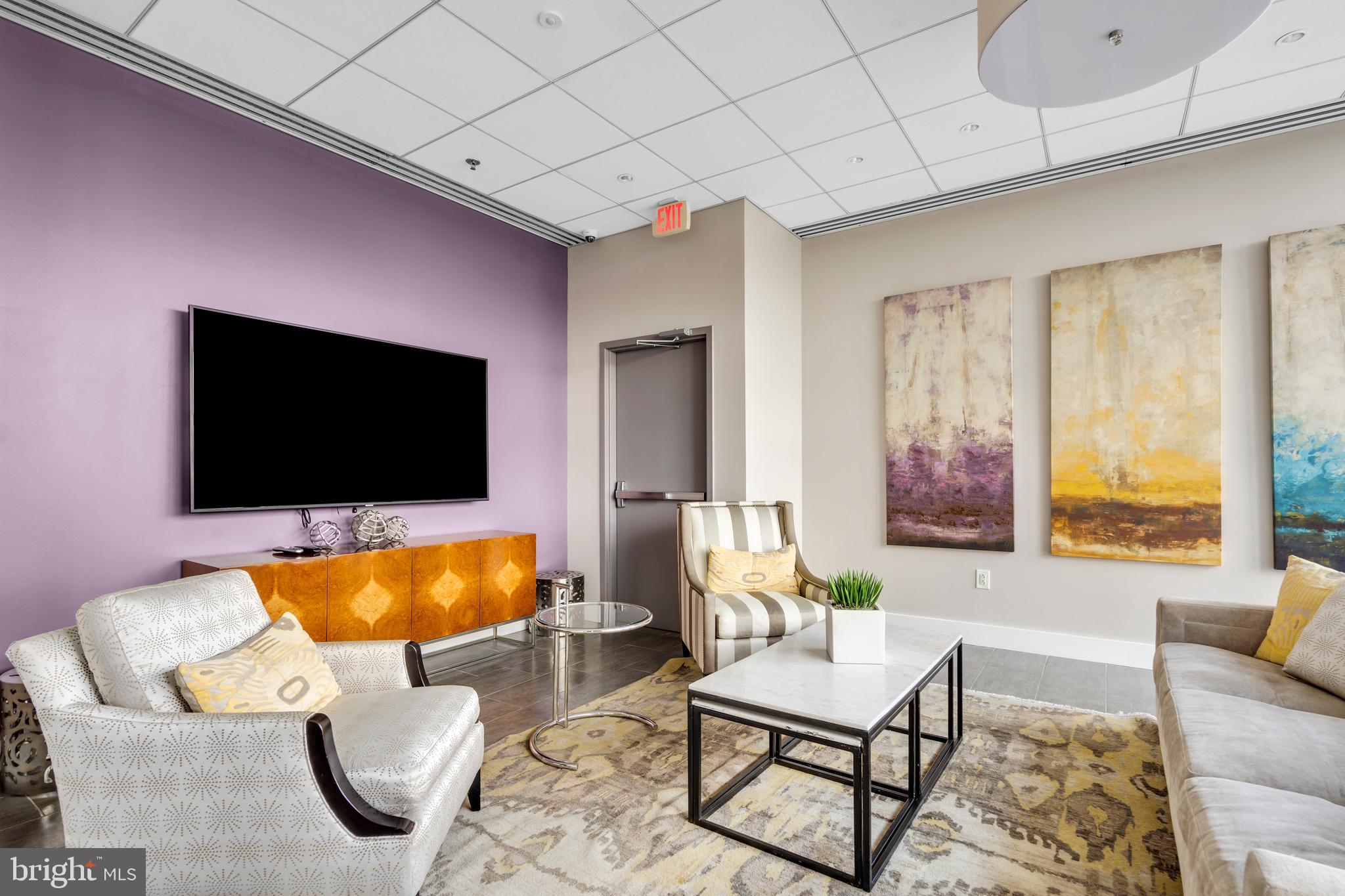 2101 Market Street, Unit PH02 Philadelphia, PA 19103 - Photo 47 of 56 a living room with furniture and a flat screen tv