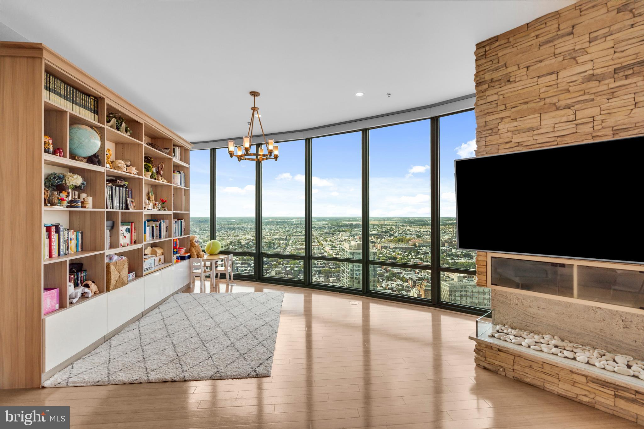 2101 Market Street, Unit PH02 Philadelphia, PA 19103 - Photo 5 of 56 a living room with furniture and a flat screen tv