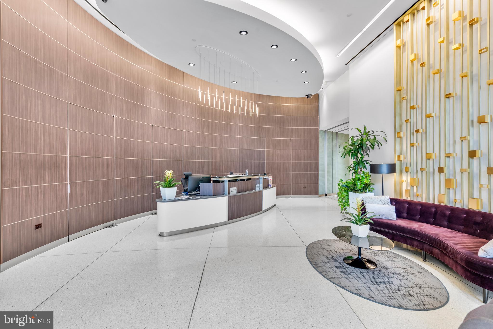2101 Market Street, Unit PH02 Philadelphia, PA 19103 - Photo 53 of 56 a living room with furniture and a potted plant