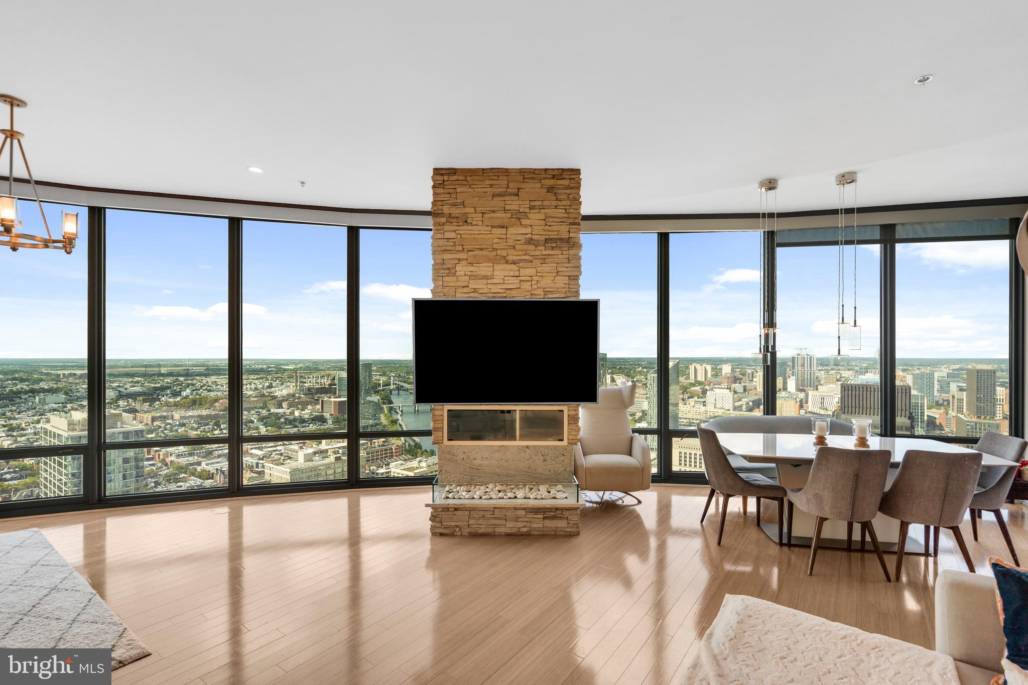 2101 Market Street, Unit PH02 Philadelphia, PA 19103 - Photo 6 of 56 a living room with furniture and large window