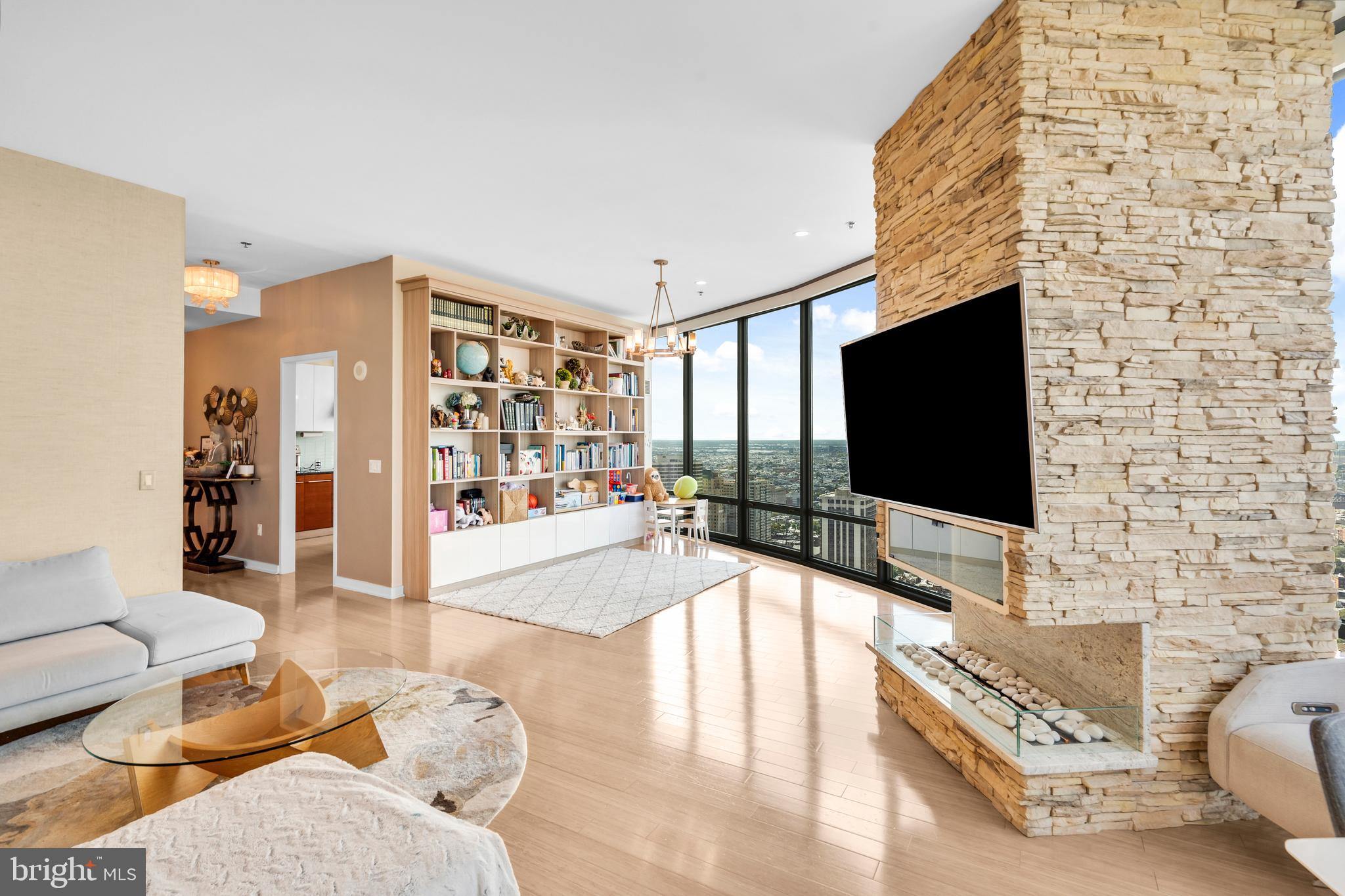 2101 Market Street, Unit PH02 Philadelphia, PA 19103 - Photo 7 of 56 a living room with furniture and a flat screen tv