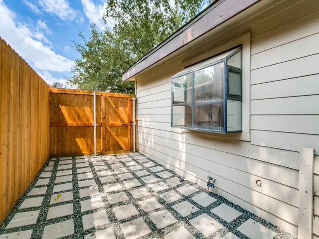 a view of a backyard of the house