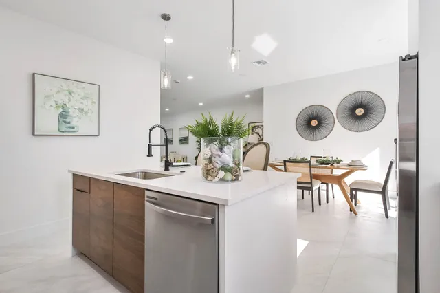 a kitchen with a table and chairs