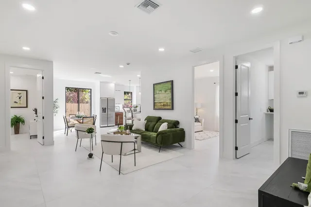 a living room with furniture and a table
