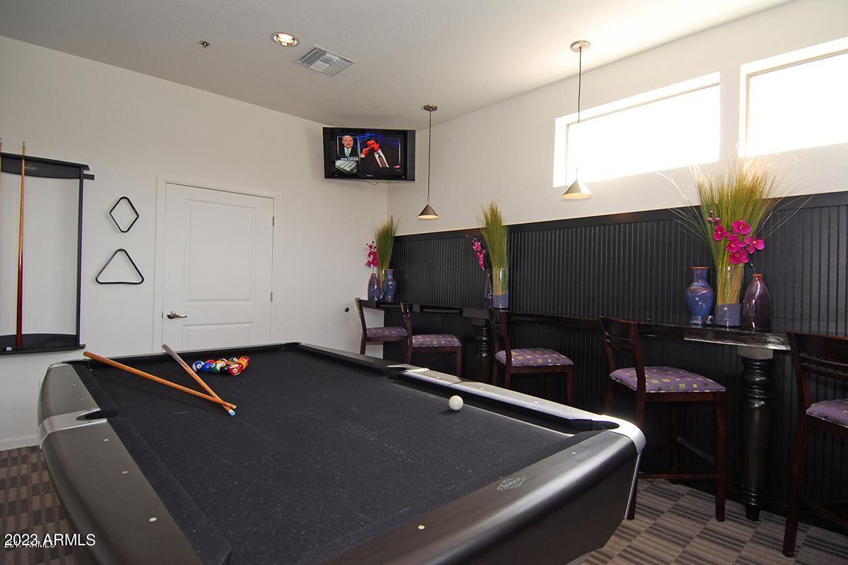 18416 North Cave Creek Road, Unit 1075 Phoenix, AZ 85032 - Photo 14 of 14 a room with furniture and screen