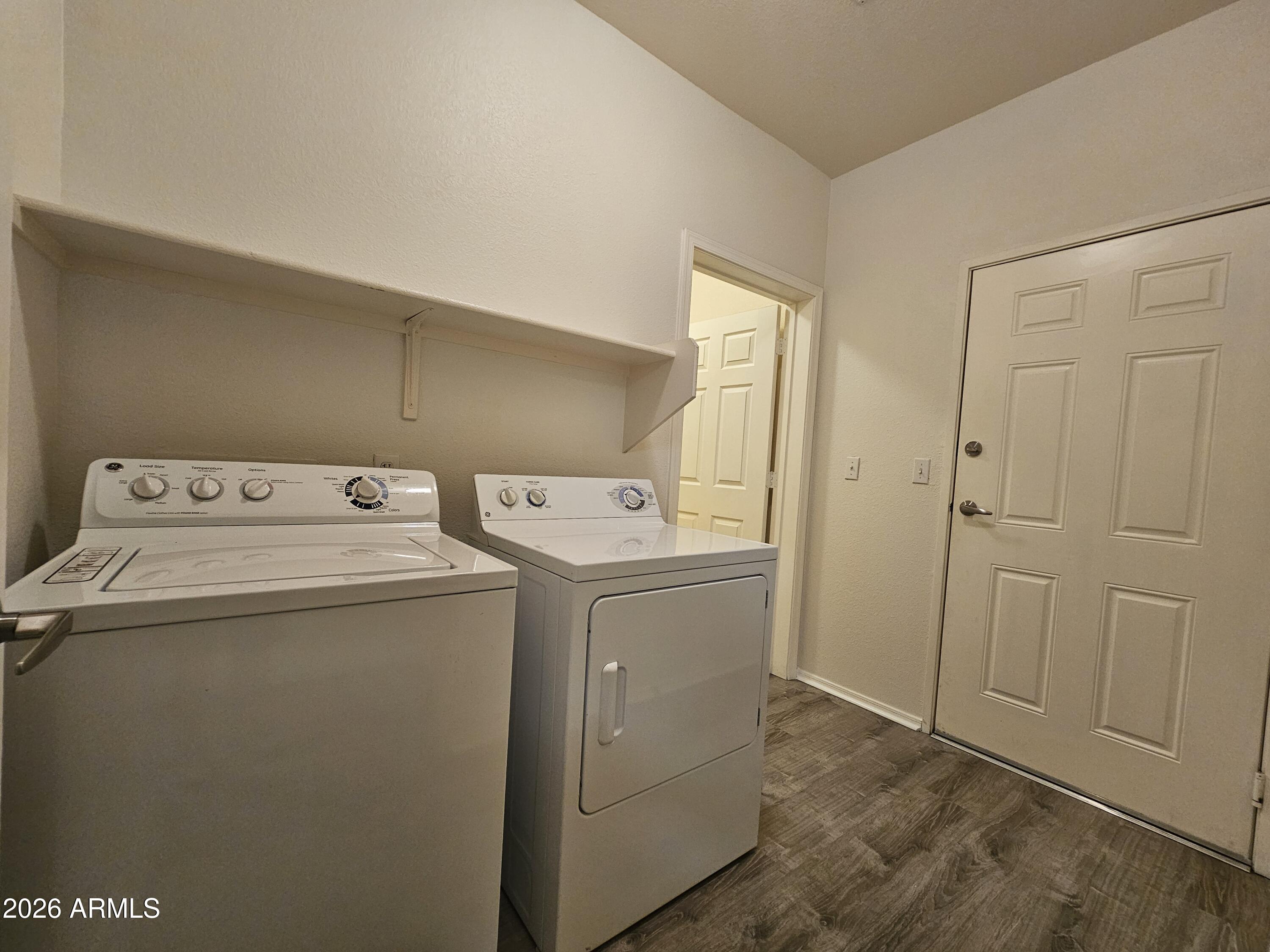 18416 North Cave Creek Road, Unit 1075 Phoenix, AZ 85032 - Photo 8 of 14 a utility room with dryer and washer