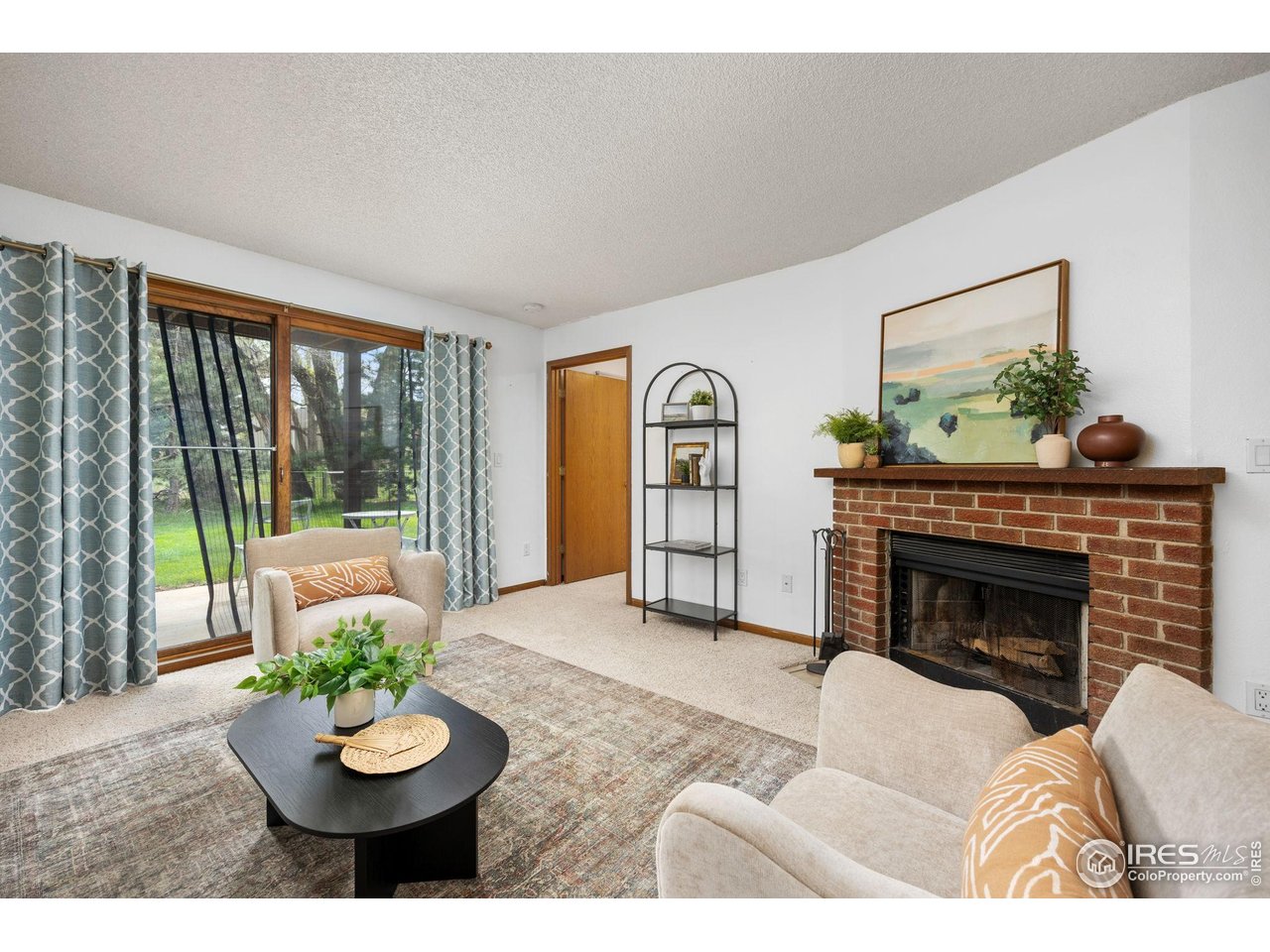 1231 West Swallow Road, Unit 314 Fort Collins, CO 80526 - Photo 11 of 29 a living room with furniture and a fireplace