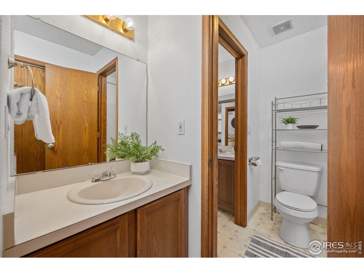 1231 West Swallow Road, Unit 314 Fort Collins, CO 80526 - Photo 15 of 29 a bathroom with a sink a toilet and shower