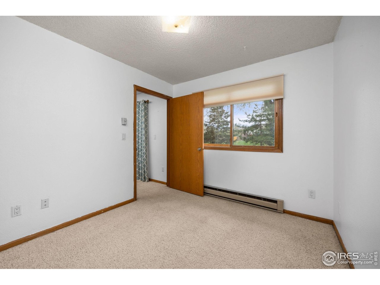 1231 West Swallow Road, Unit 314 Fort Collins, CO 80526 - Photo 16 of 29 an empty room with windows