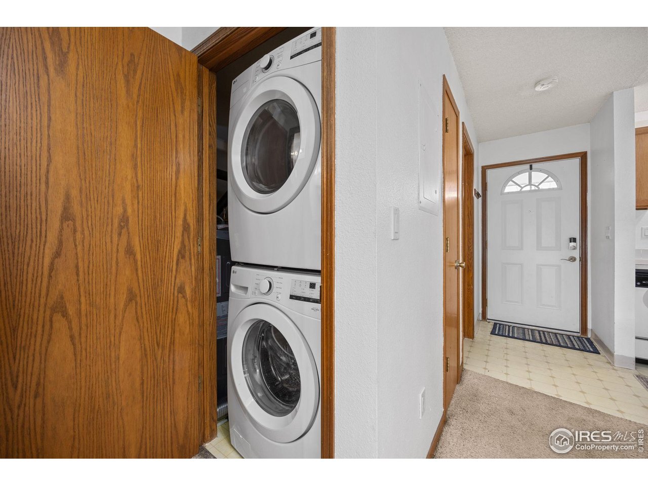 1231 West Swallow Road, Unit 314 Fort Collins, CO 80526 - Photo 18 of 29 a view of a hallway with washer and dryer