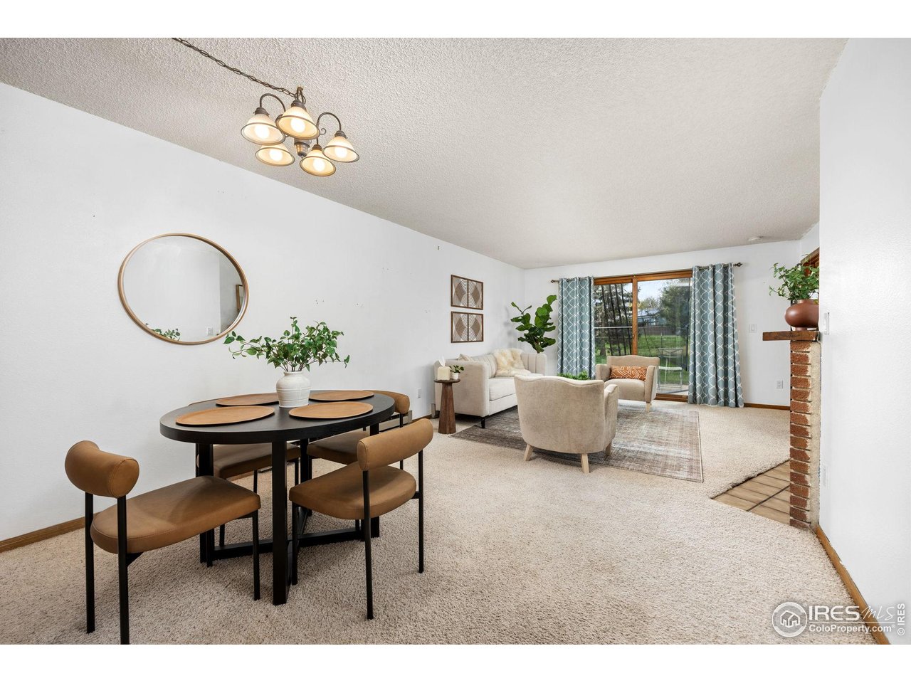 1231 West Swallow Road, Unit 314 Fort Collins, CO 80526 - Photo 8 of 29 a view of a dining room with furniture and chandelier