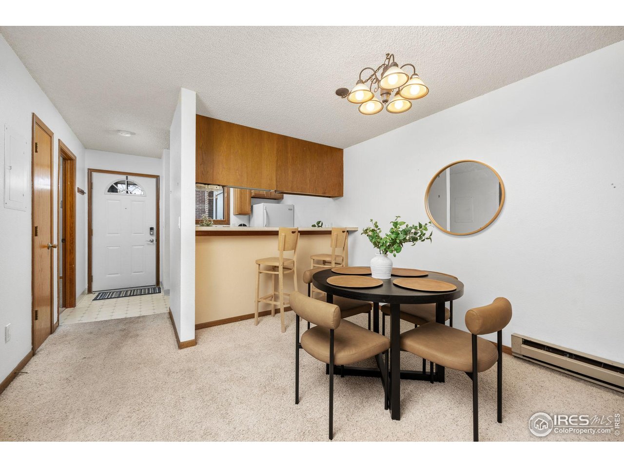 1231 West Swallow Road, Unit 314 Fort Collins, CO 80526 - Photo 9 of 29 a view of a dining room with furniture and wooden floor