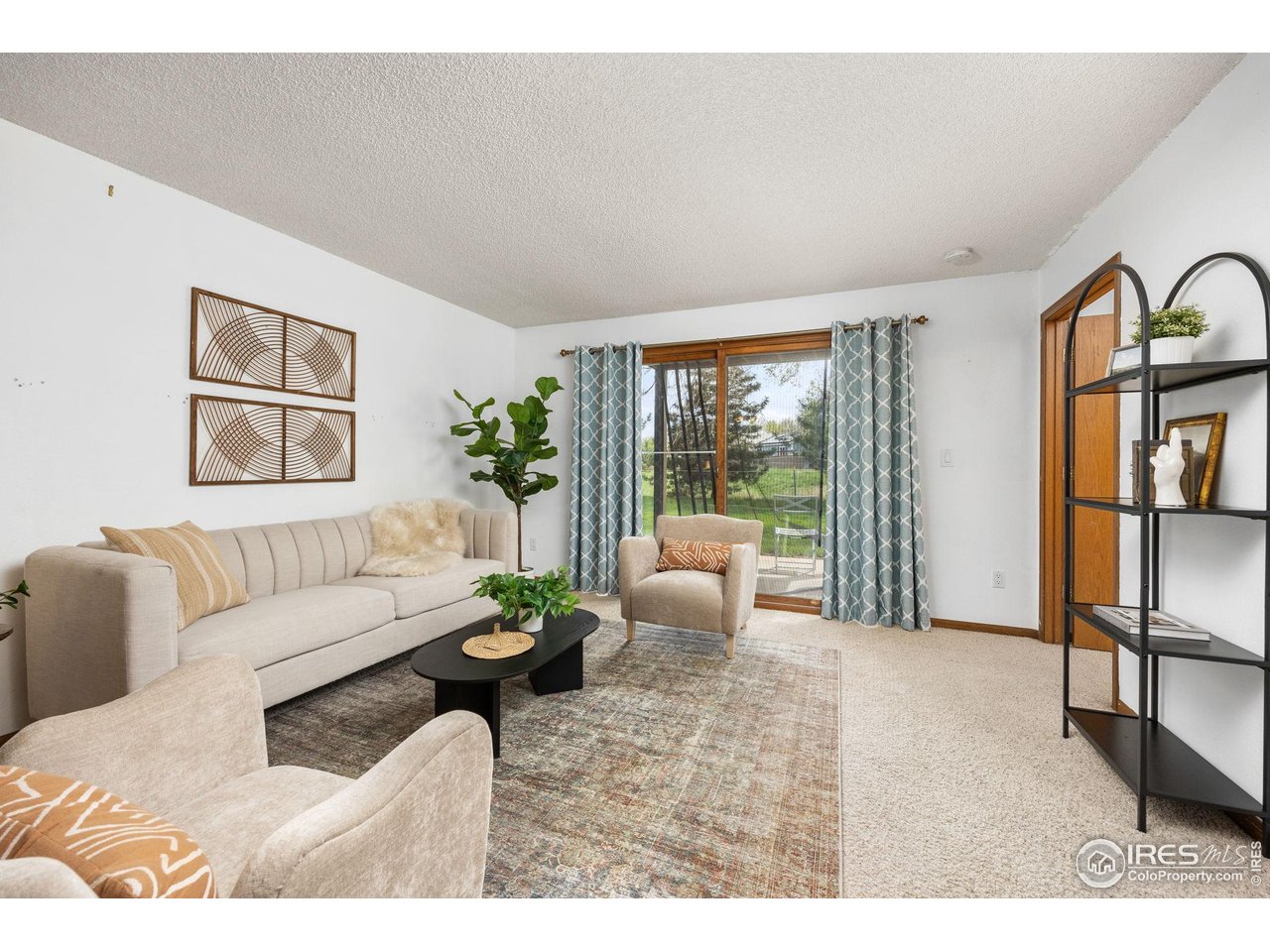 1231 West Swallow Road, Unit 314 Fort Collins, CO 80526 - Photo 10 of 29 a living room with furniture potted plant and a large window