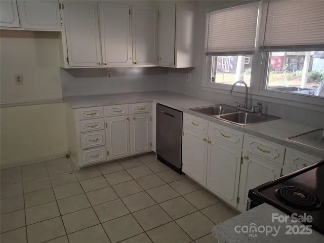 a kitchen with a sink and cabinets