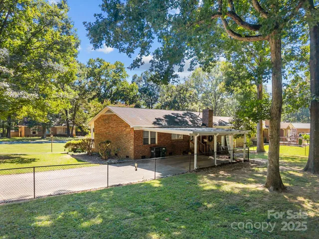 a view of a house with a yard porch and sitting area