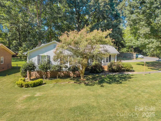 a view of a house with backyard porch and sitting area