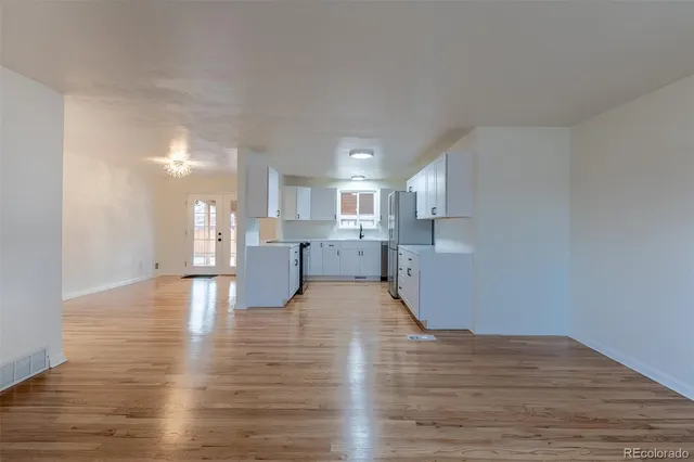 a view of kitchen with wooden floor