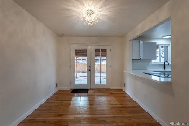 a view of a kitchen with a sink and a window