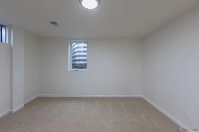 an empty room with closet area