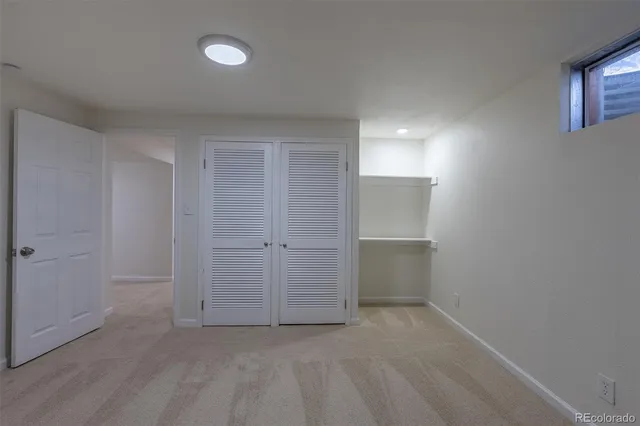 a bathroom with a sink mirror and toilet