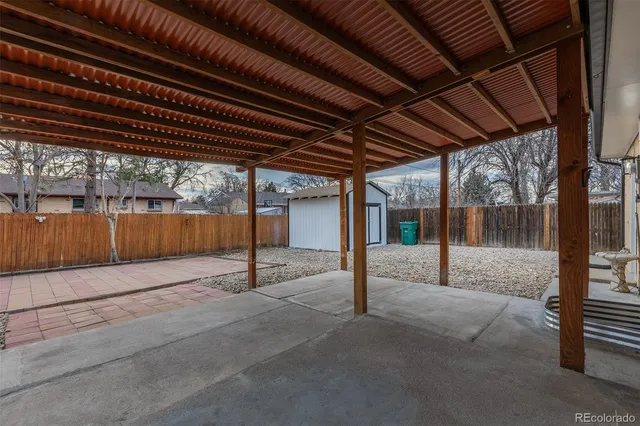 a front view of house with a garden