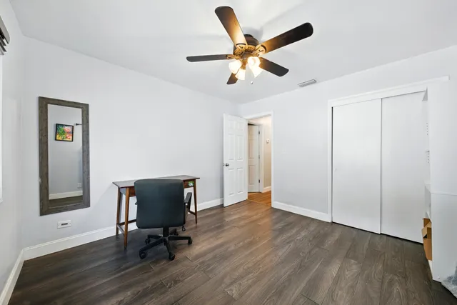 a bedroom with a large bed and a flat screen tv