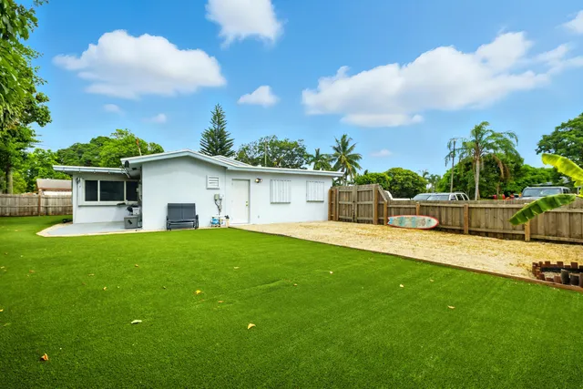 a view of a backyard with a garden and plants