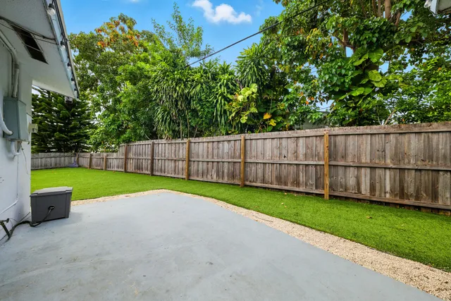 a view of a backyard with a small cabin
