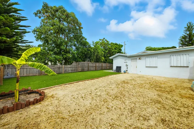 a house view with a garden space