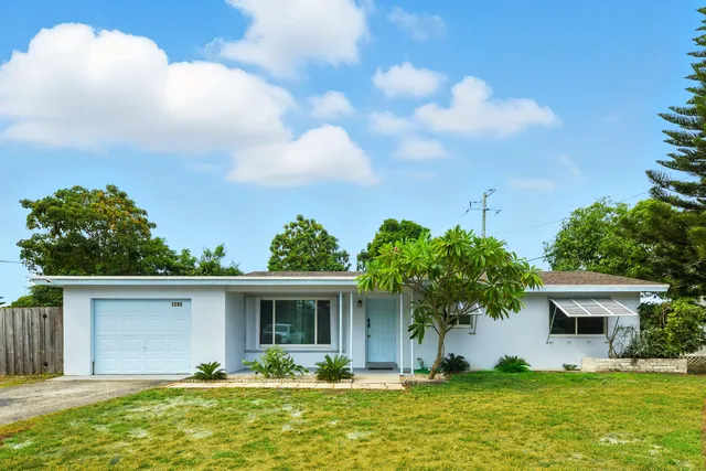 a front view of house with yard