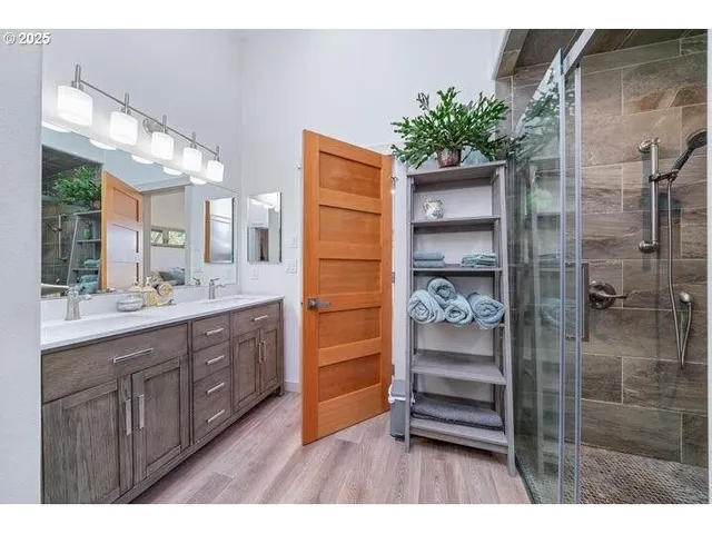a bathroom with a double vanity sink and a mirror