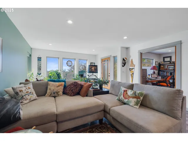 a bedroom with furniture and wooden floor