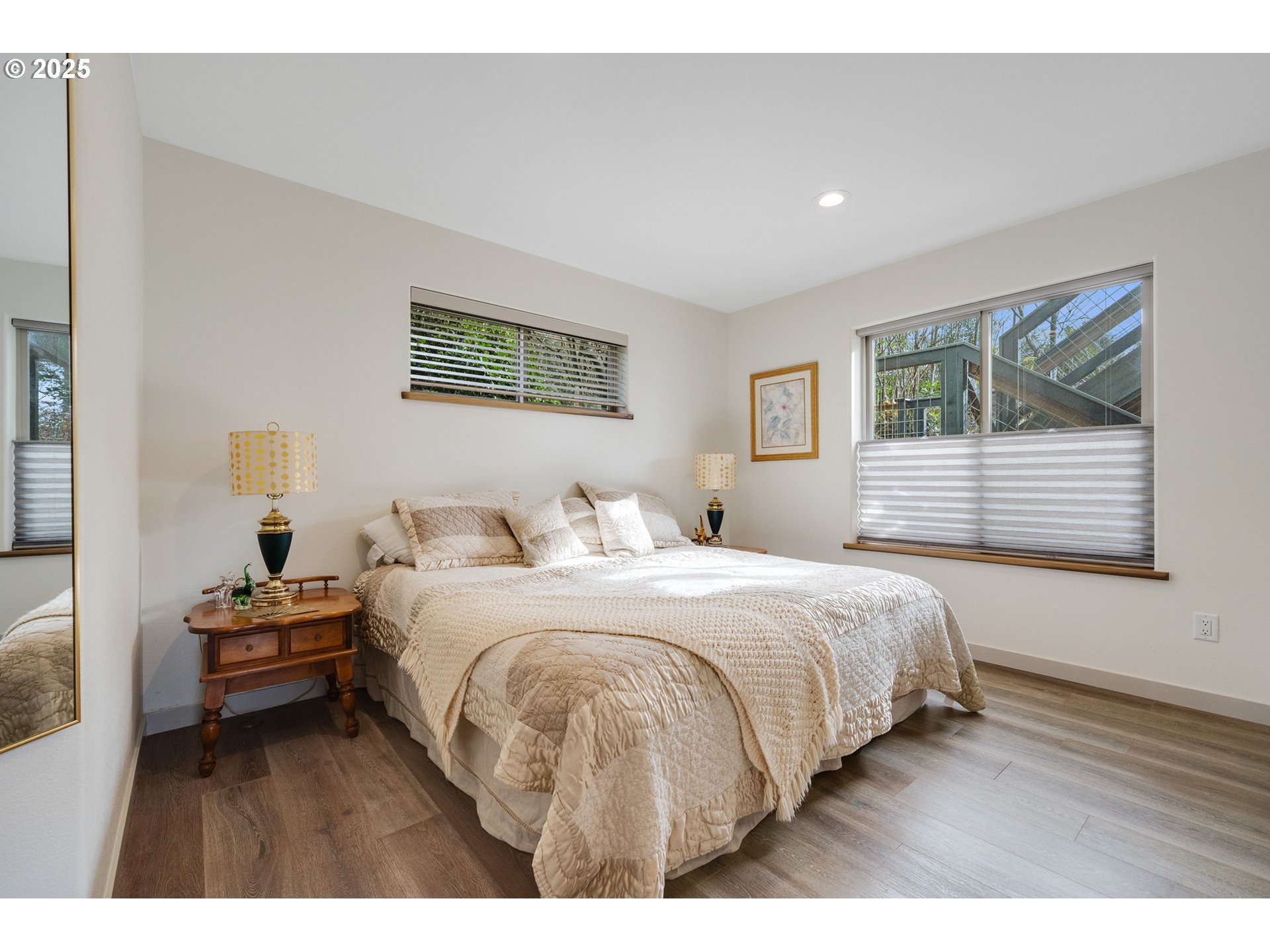 9065 8th Street Bay City, OR 97107 - Photo 35 of 48 a bedroom with a bed and a night stand