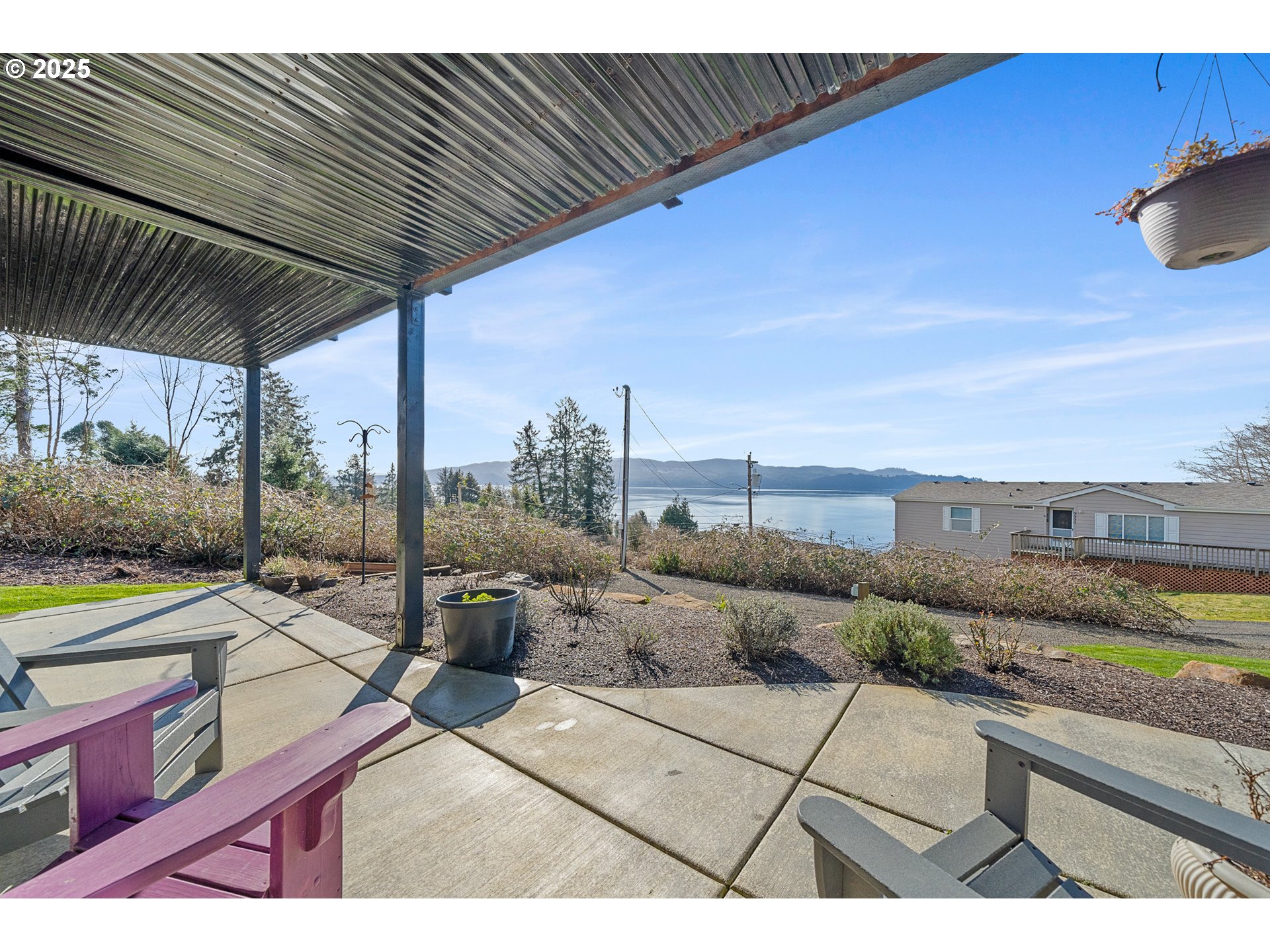 9065 8th Street Bay City, OR 97107 - Photo 38 of 48 a view of a terrace with furniture and a garden