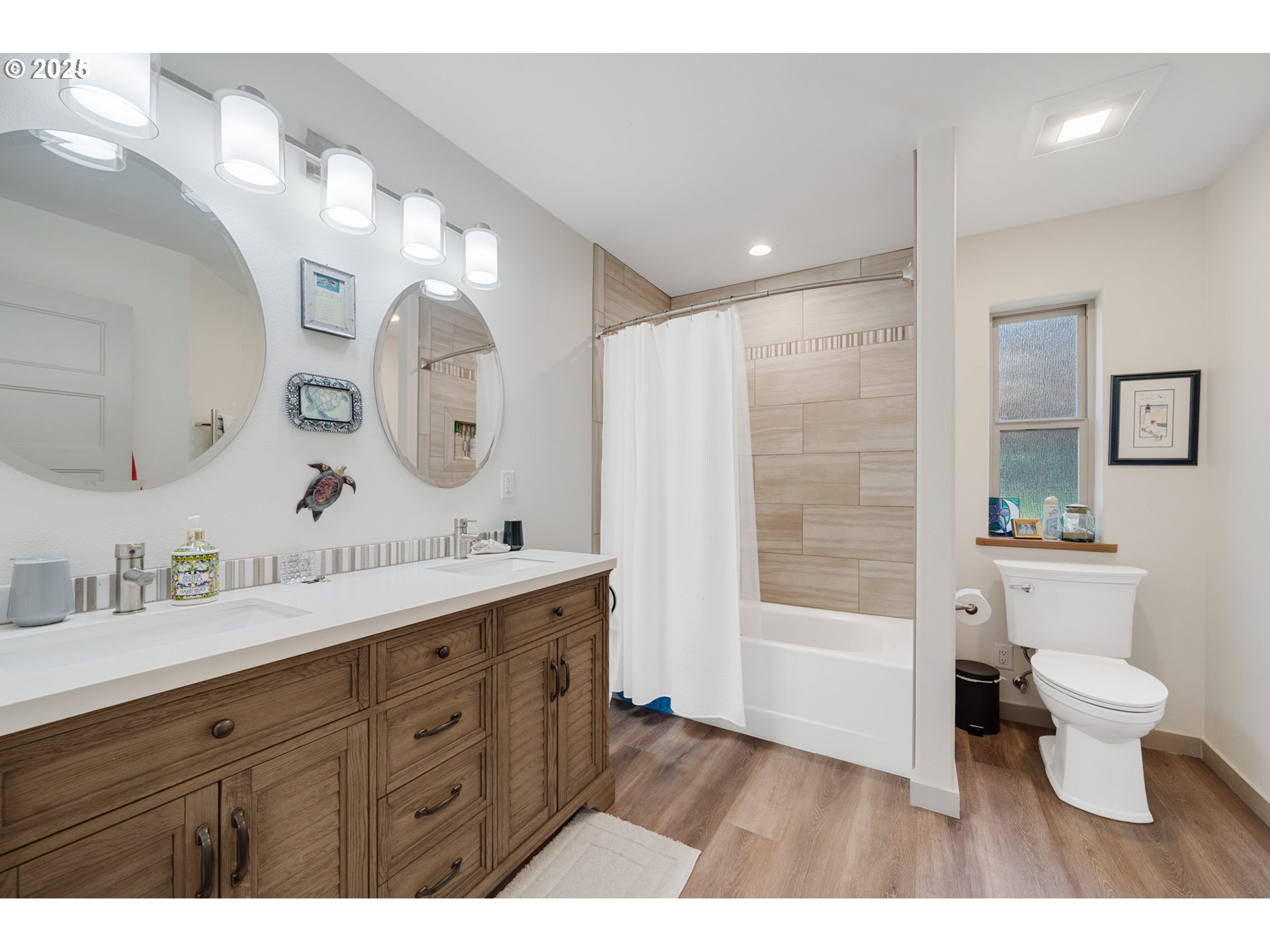 9065 8th Street Bay City, OR 97107 - Photo 39 of 48 a bathroom with a double vanity sink mirror and toilet