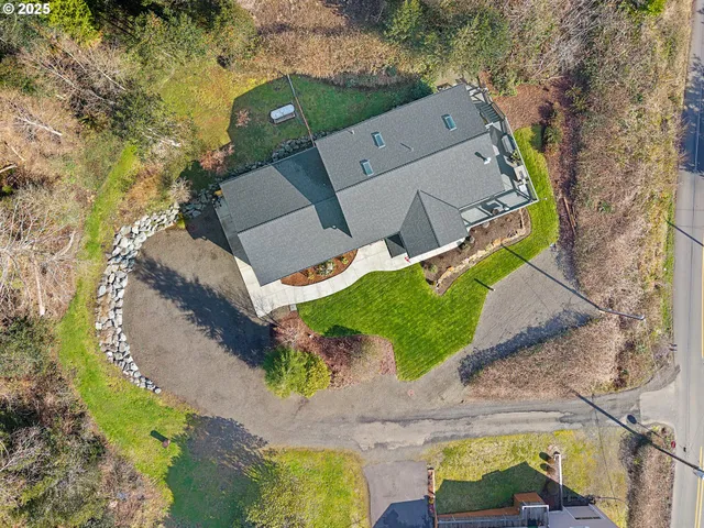 an aerial view of a house with a swimming pool