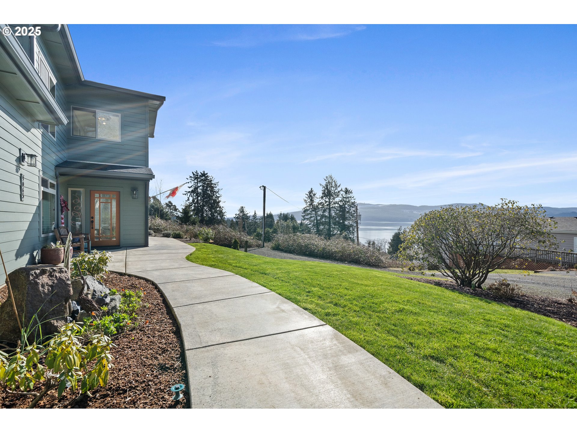 9065 8th Street Bay City, OR 97107 - Photo 5 of 48 a view of a house with a yard