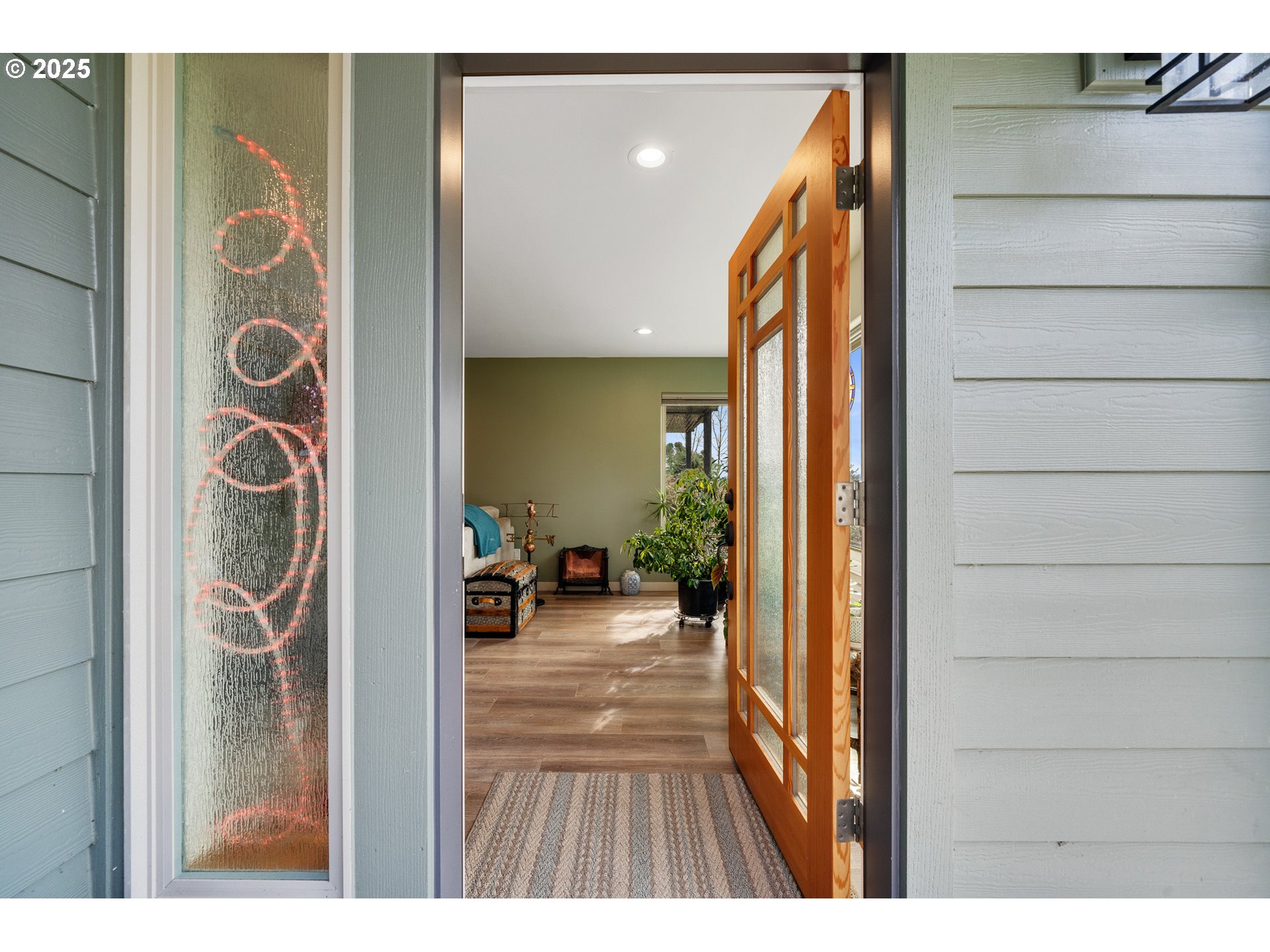 9065 8th Street Bay City, OR 97107 - Photo 7 of 48 a view of a hallway and a livingroom with furniture