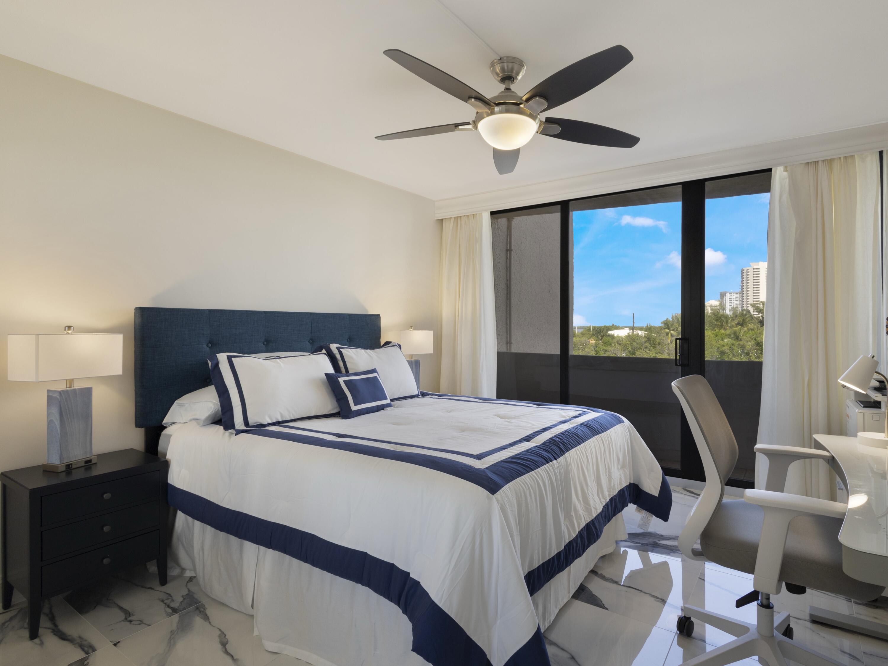 4200 North Ocean Drive, Unit 2301 Singer Island, FL 33404 - Photo 17 of 52 a bedroom with a bed and a large window