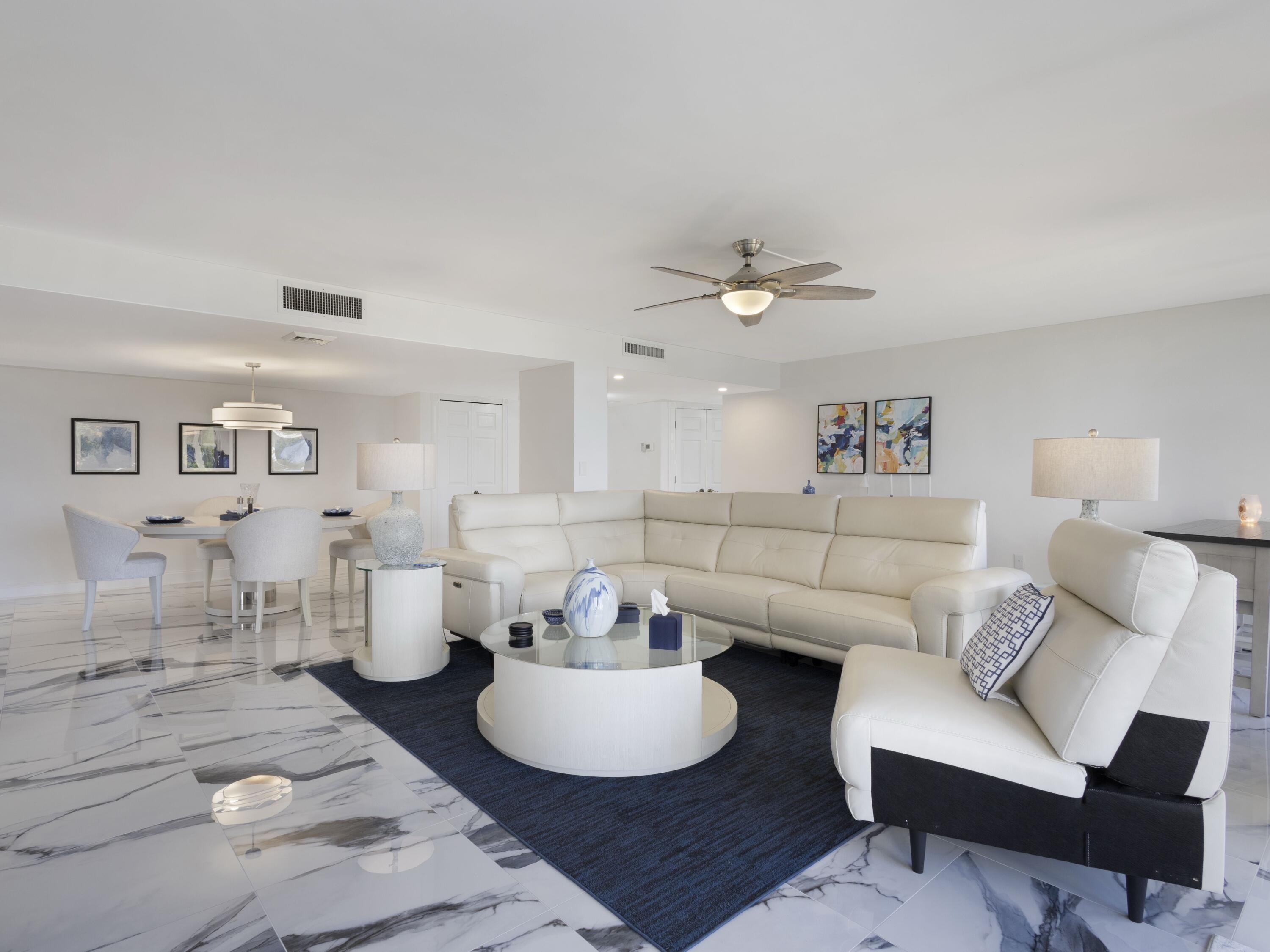 4200 North Ocean Drive, Unit 2301 Singer Island, FL 33404 - Photo 3 of 52 a living room with furniture and a table