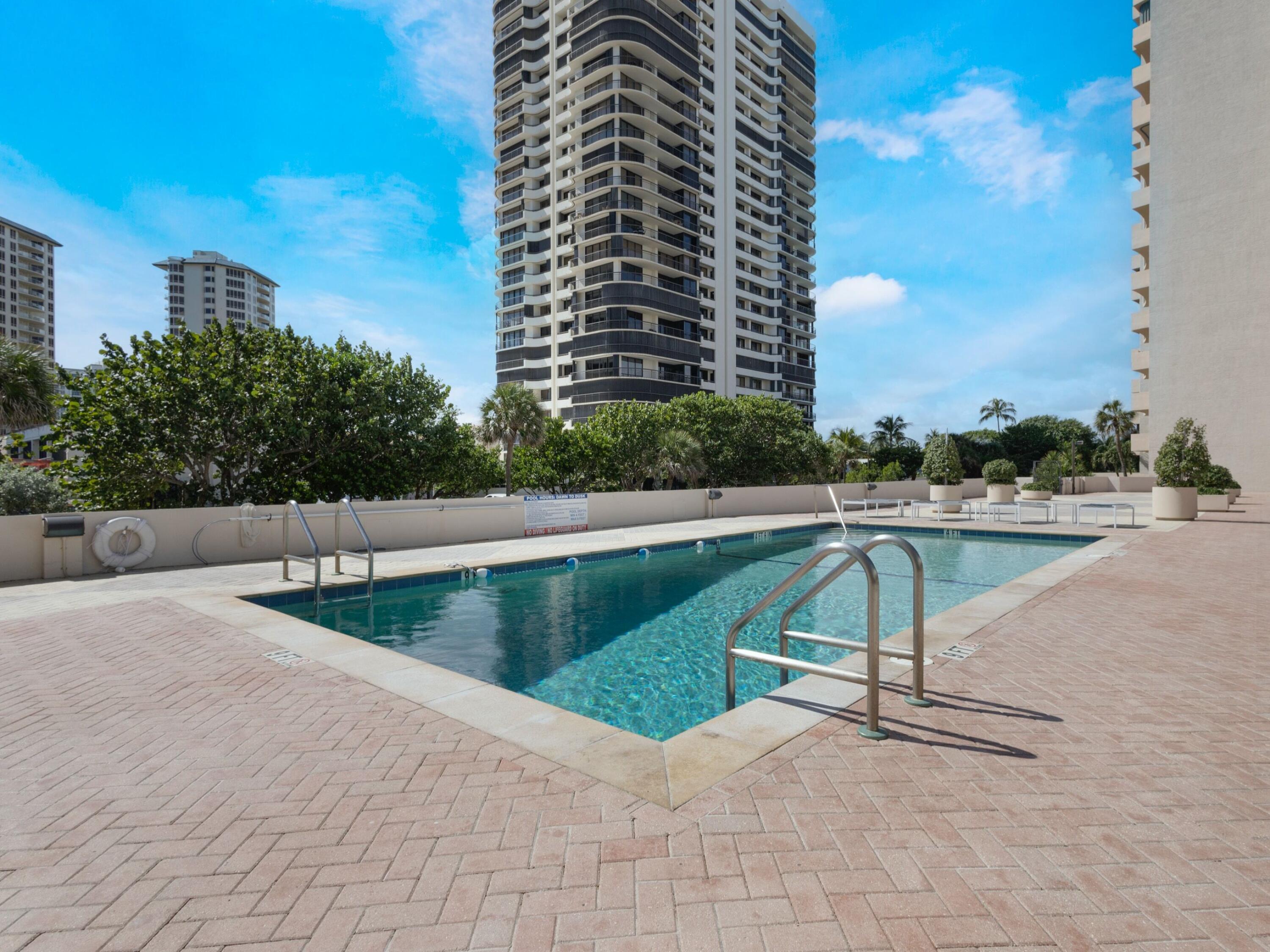 4200 North Ocean Drive, Unit 2301 Singer Island, FL 33404 - Photo 41 of 52 a view of a swimming pool with a bench