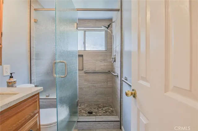 a bathroom with a shower and a sink